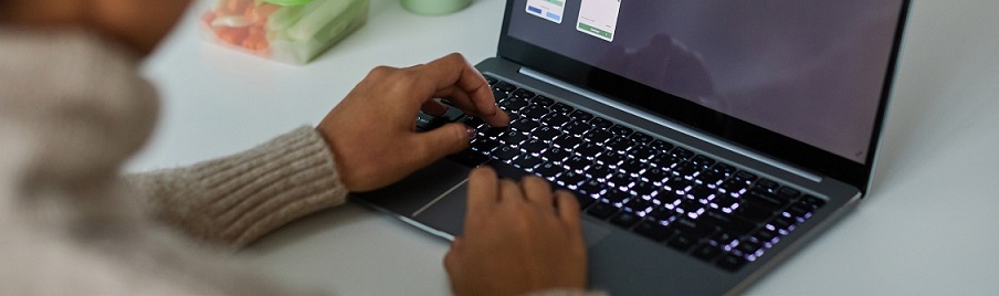 Photo of a person using laptop