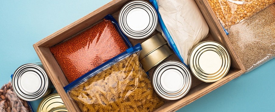 Photo of canned food, dry beans, dry pasta in packages