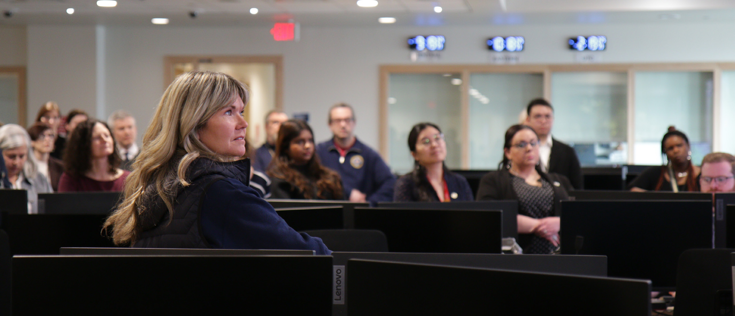 A photo of people in a meeting room