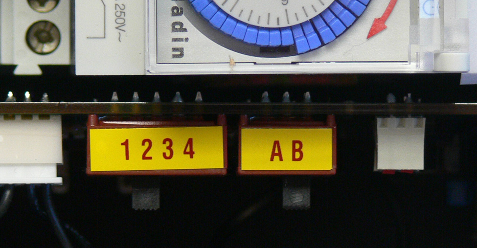 This picture a closeup of the frequency and sound level switches inside most bird banger control boxes. The frequency setting has the numerals 1, 2, 3 and 4, while the sound level setting has the letters, A and B.