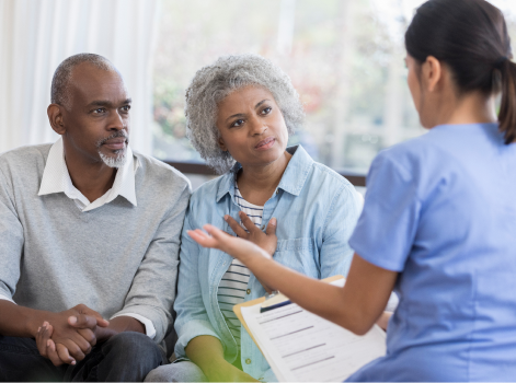 Health care worker is discussing care needs with couple