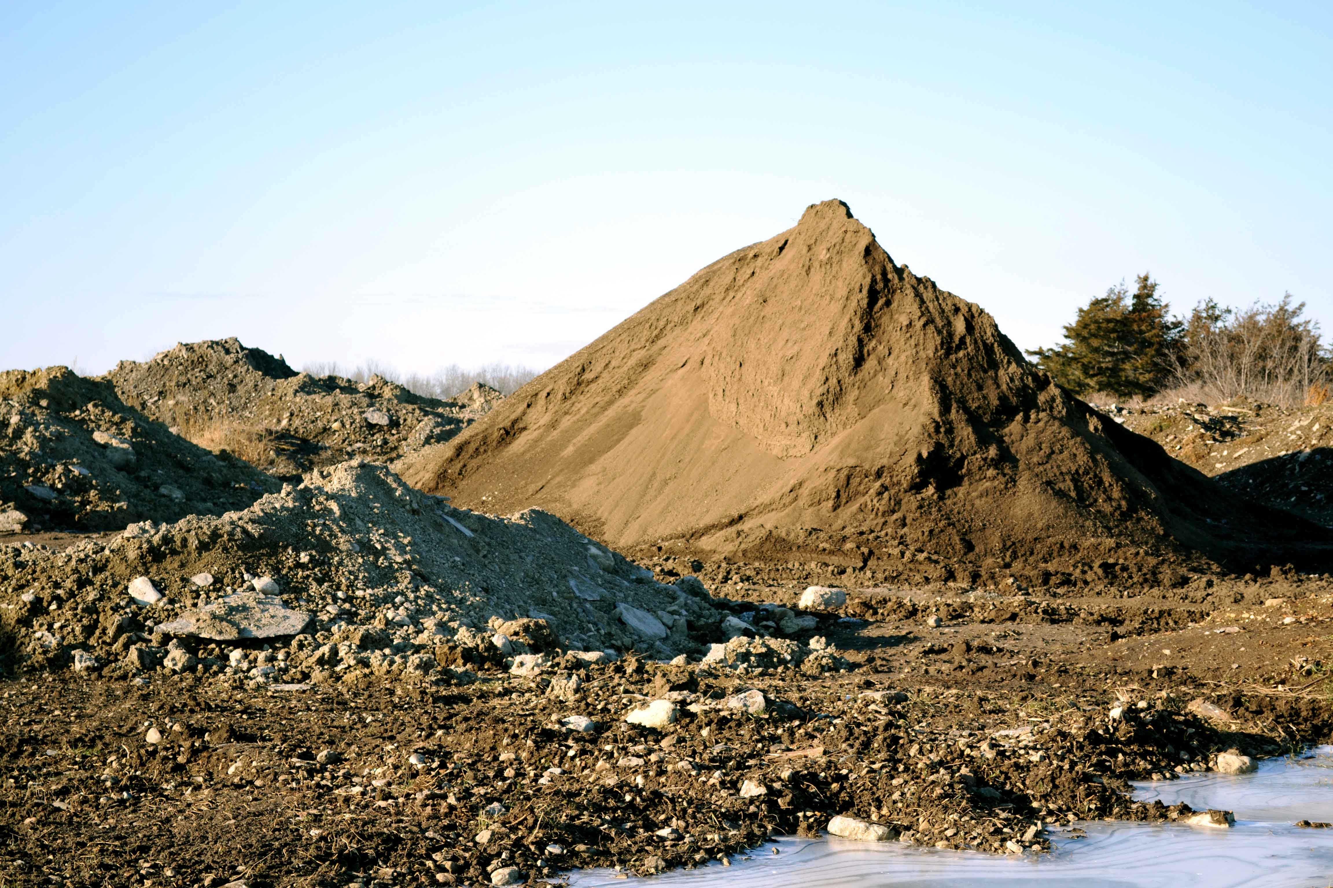 Several stockpiles of soil of varying quality