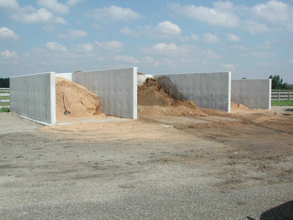A concrete walled structure that can be used for manure storage. This bunker structure is divided into 3 sections and has no roof overhead.