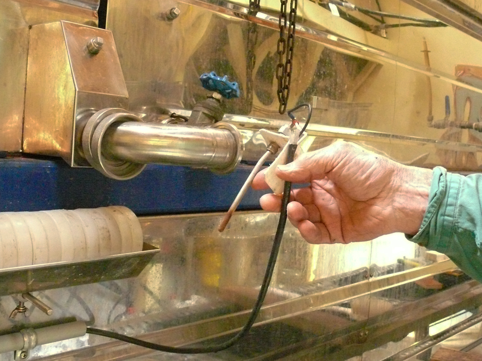 A low-sap level shutoff sensor placed in the float box to the flue pan or into the flue pan directly to measure sap leve