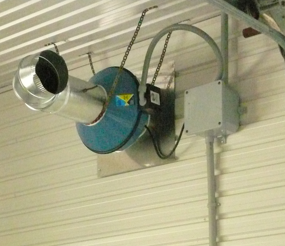Wall mounted fan to introduce fresh air into room housing evaporator if activated by pressure switch on the oil burner