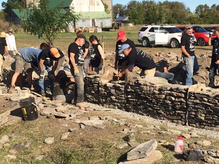 Drystone Wall Festival participants explore wall construction methods