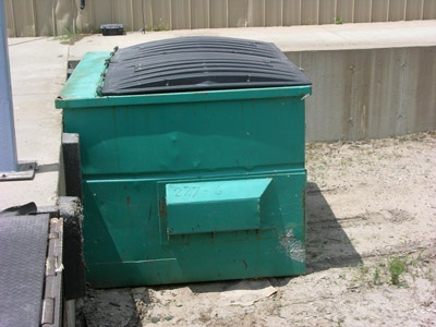 Figure 11. Photo of a covered bin for garbage bags containing discarded plant material.