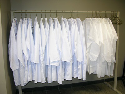Figure 4. Photo showing a rack of clean lab coats for visitors.