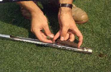 Remove and discard upper thatch layer and grass blades.