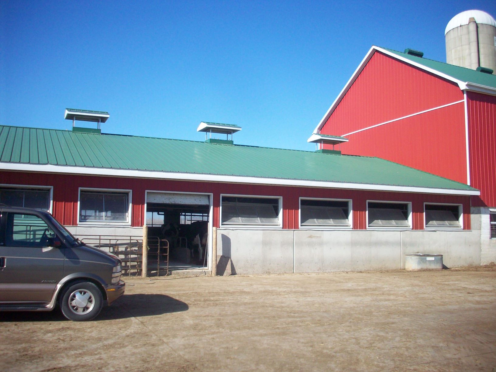 side view, of a single-storey dairy barn