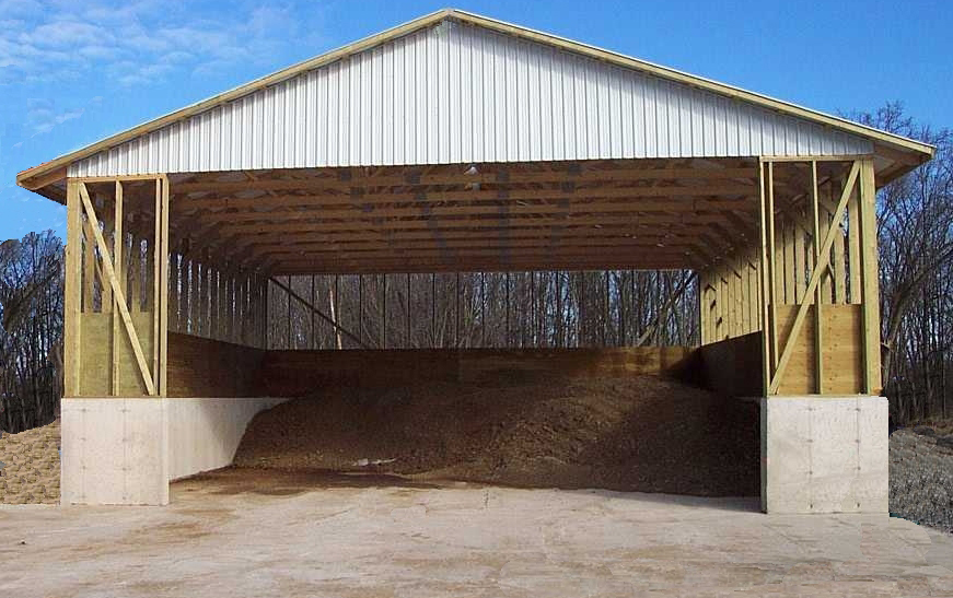A roofed storage structure with solid manure inside
