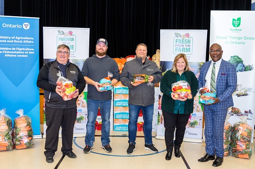 An event to promote the Fresh from the Farm program: Steve Martin, Martin’s Family Fruit Farm, Nathan Streef, Streef Produce, Jason Verkaik, Carron Farms, Lisa Thompson, Ontario Minister of Agriculture, Food and Rural Affairs, David Smith, MPP Scarborough Centre. This photo was taken at Our Lady of Wisdom Catholic School in Scarborough, Ontario.
