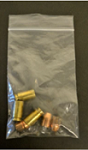 Photo of shell casings in a clear resealable evidence bag.