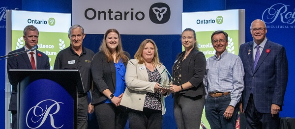 Minister Rob Flack and PA John Jordan awarding Farm & Food Care Ontario with the Promotional  Excellence category award.