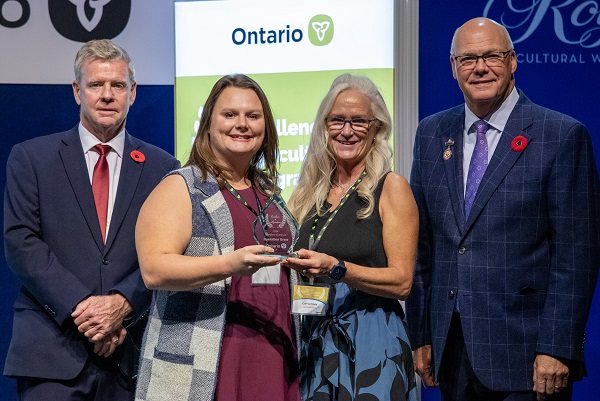 Minister Rob Flack and PA John Jordan awarding Haily MacDonald and Corrine Flude with the Workforce Excellence category award.