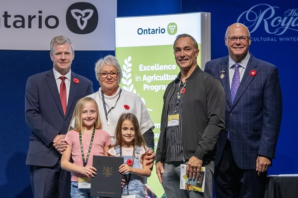 Minister Rob Flack and PA John Jordan awarding Mattagami Heights Farm with the Northern Business Excellence category Honourable Mention certificate.