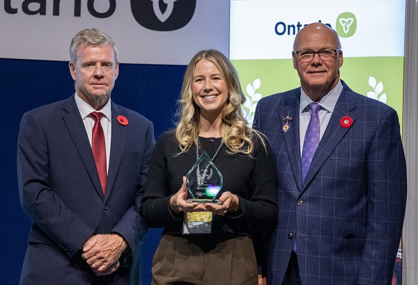Minister Rob Flack and PA John Jordan awarding Beckie Prime with the Youth Excellence category Award.