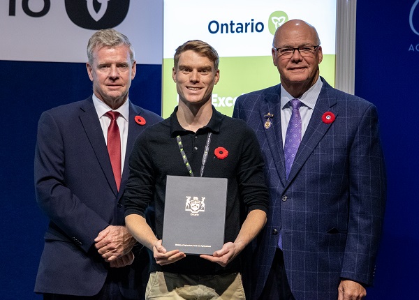 Minister Rob Flack and PA John Jordan awarding Derrik Stevenson with the Youth Excellence category Honourable Mention certificate.