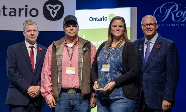 Minister Rob Flack and PA John Jordan awarding Evan and Linda Debney with the Farm Family Excellence category Award.