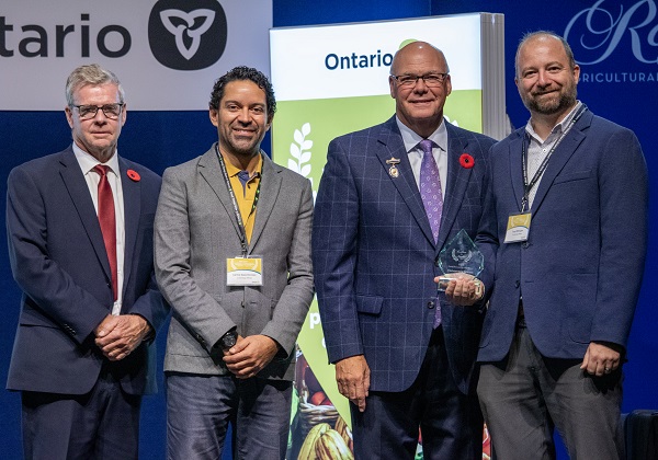 Minister Rob Flack and PA John Jordan awarding Conestoga Meats with the Food Processing Excellence category award.