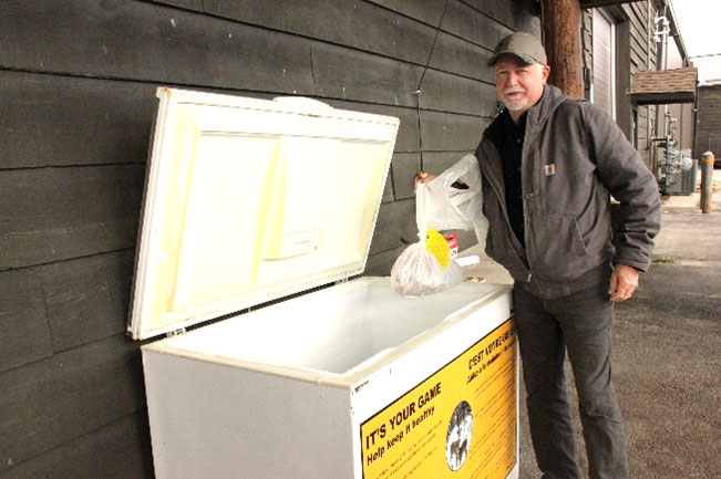 Hunter submitting a sample from harvested deer at a CWD depot.